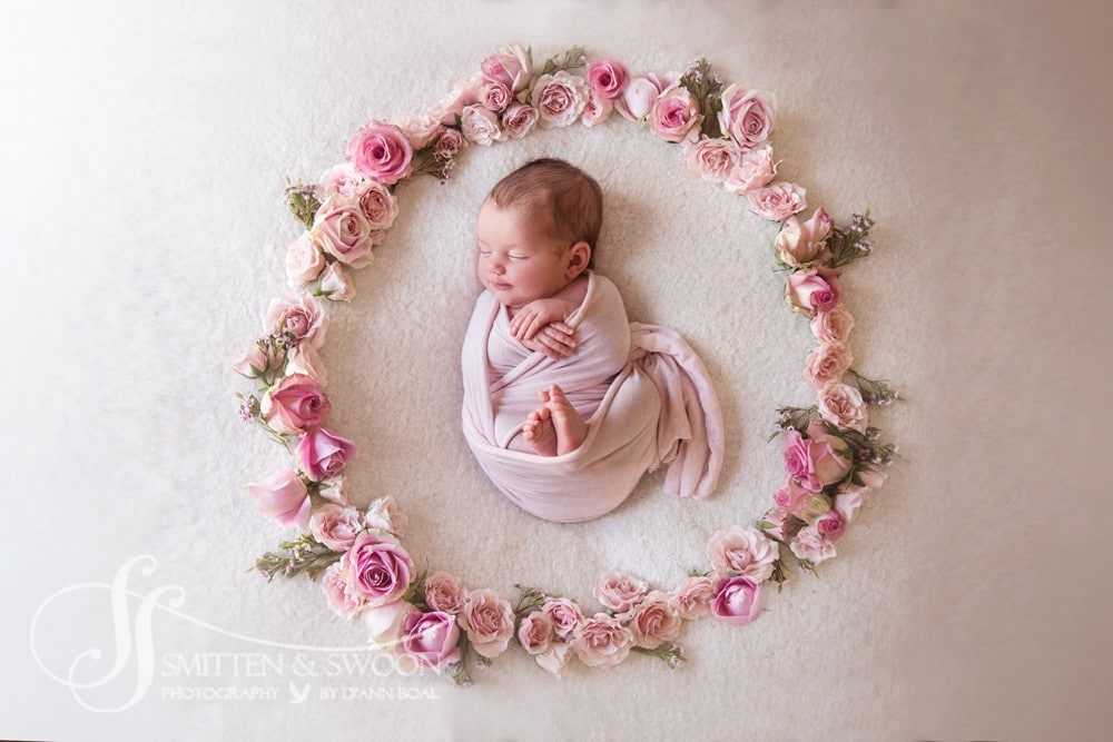 newborn baby sleeping in a flower wreath {boulder newborn photographer 