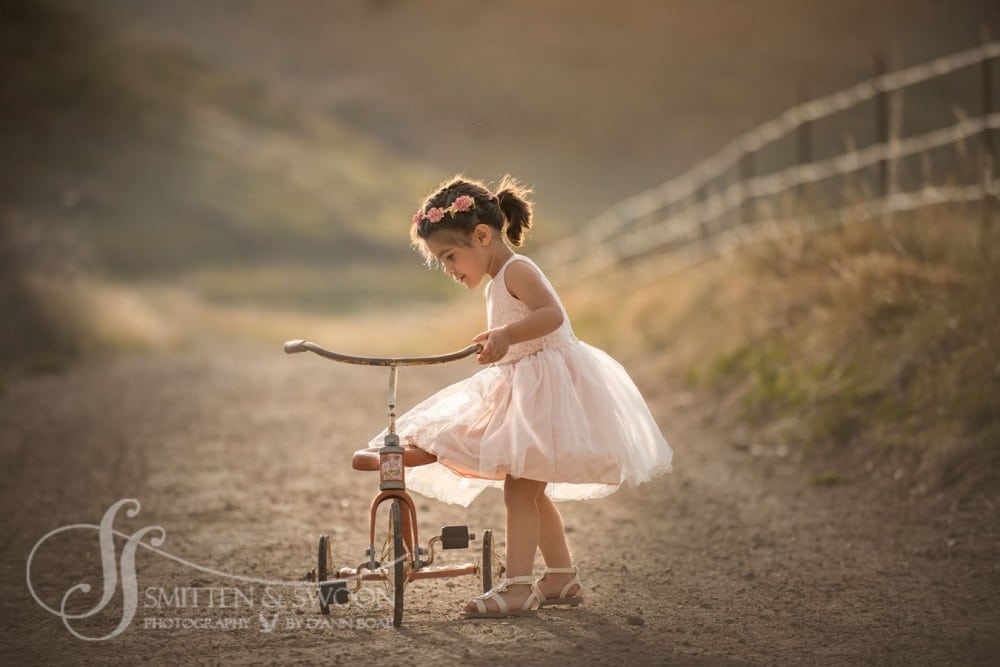 little girl in pink dress with old tricycle {boulder child photographer}