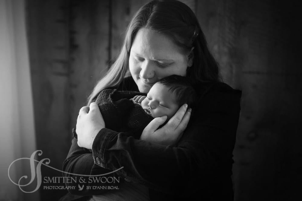 mom hugging newborn baby boy {boulder newborn photographer}