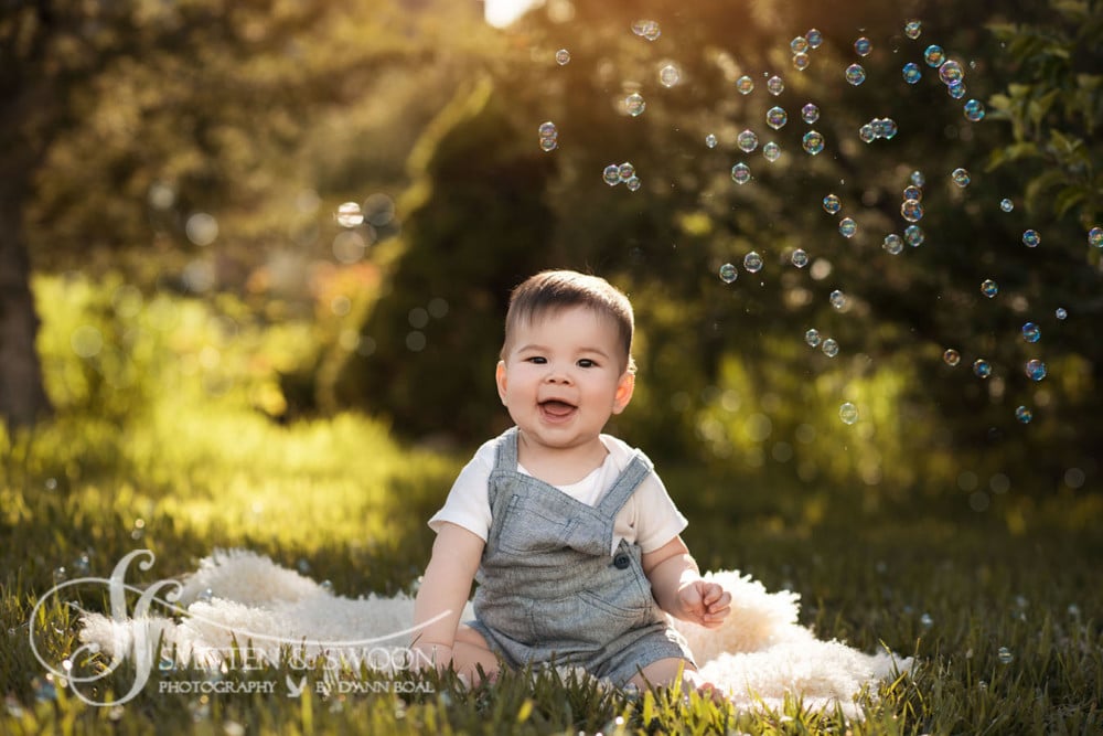 baby boy smiling in garden with bubbles {boulder baby photographer}