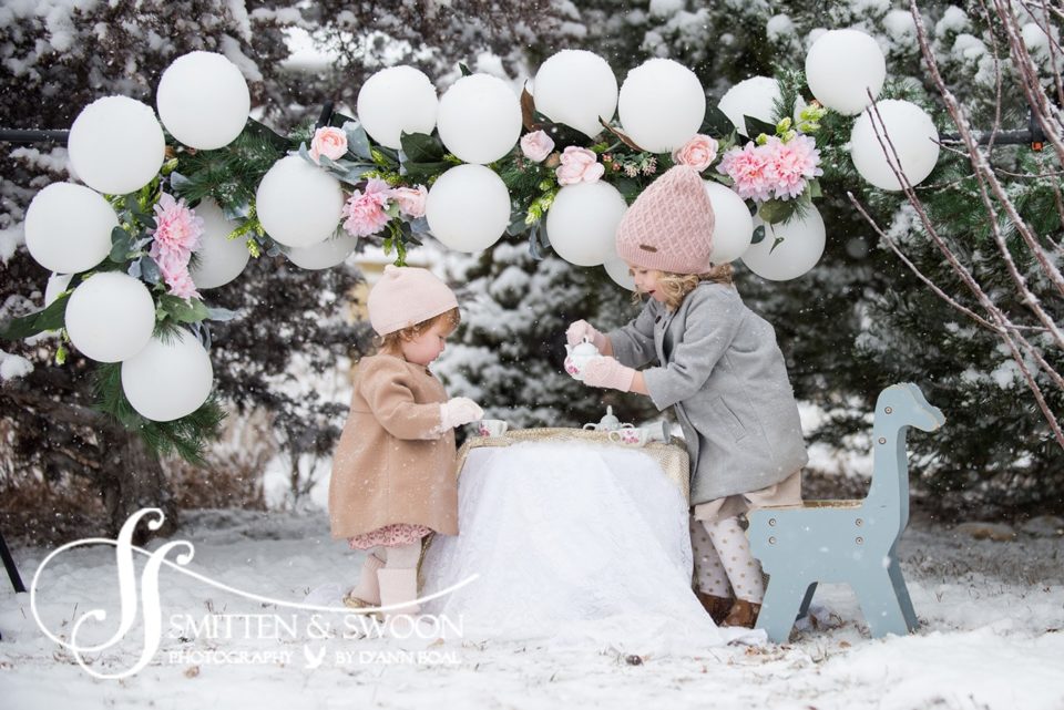 baby girl and big sister having a snowy tea party - boulder photographer