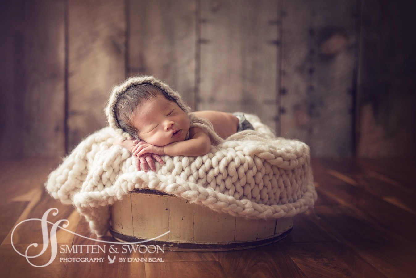 newborn baby boy in basket boulder newborn photographer