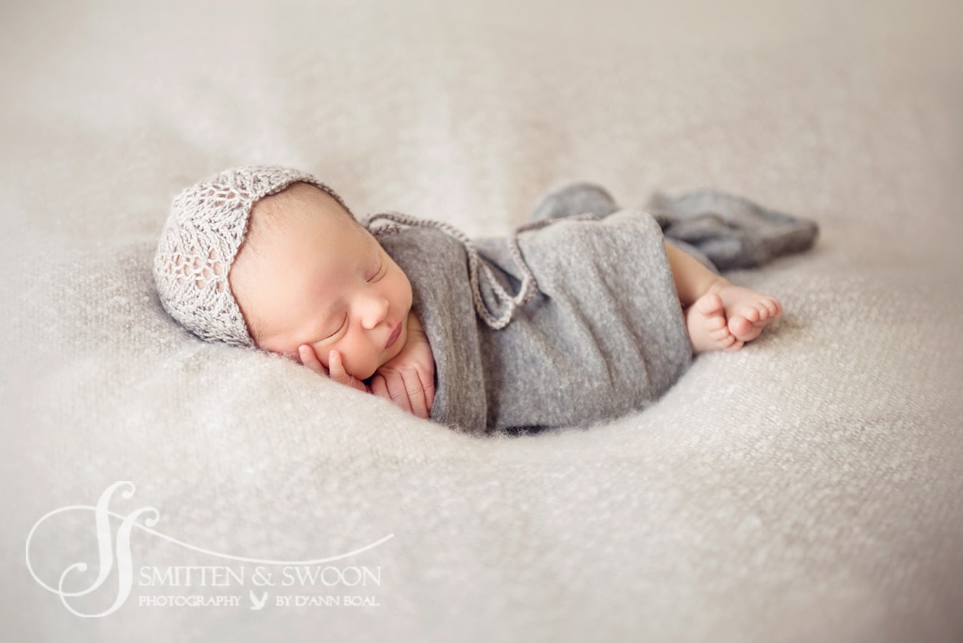 brand new baby sleeping in gray with lace bonnet boulder baby photographer