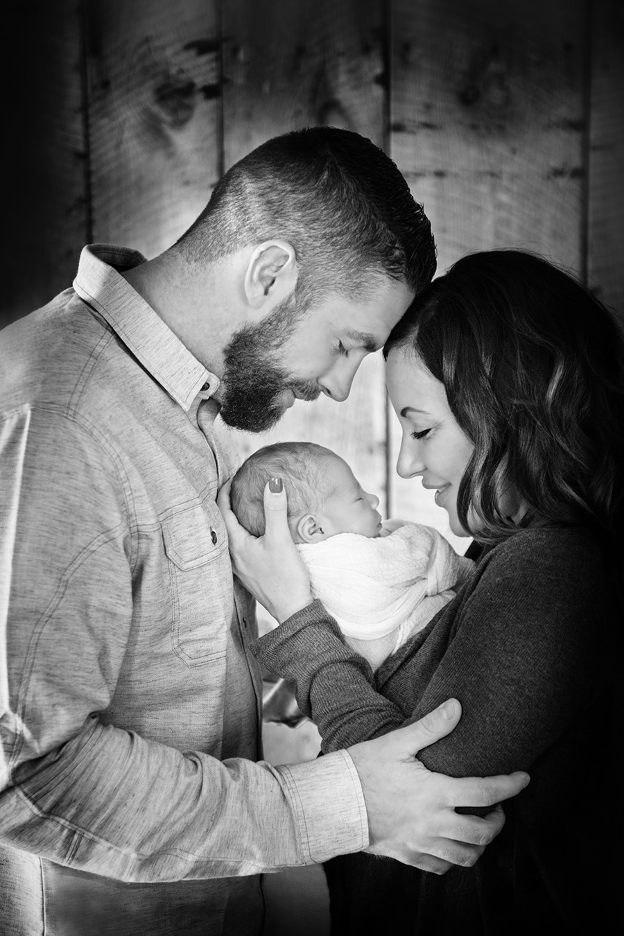 family of three profiles with newborn baby boy black and white - boulder newborn photographer