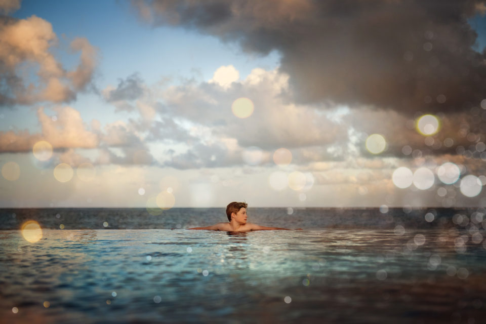 boy in water by the sea Boulder newborn child & family photographer | the experience