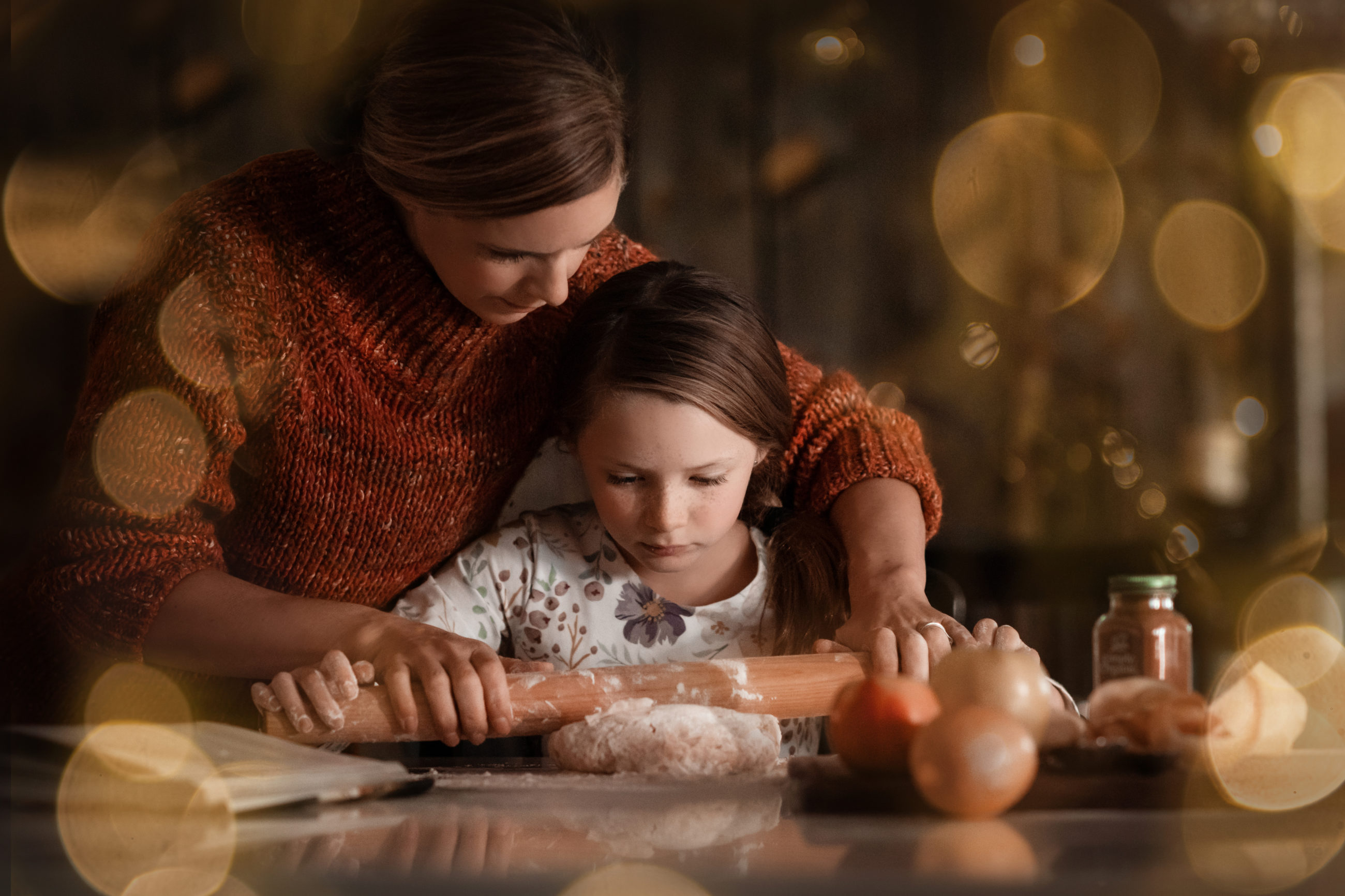 mom and daughter portrait in the kitchen rolling out dough - boulder photographer